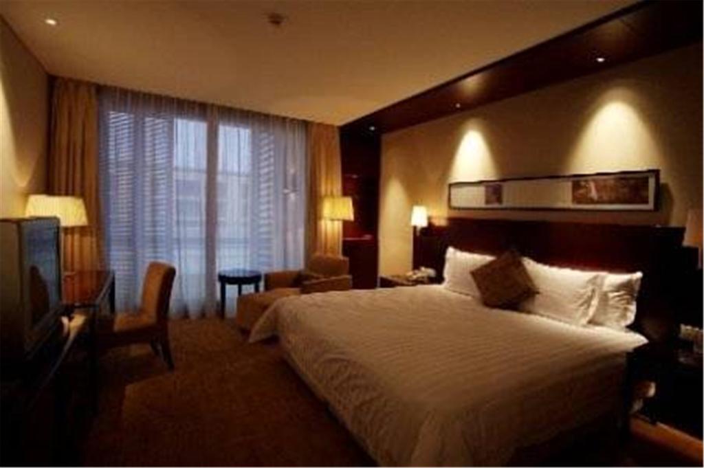 Howard Johnson Plaza Lingang Shanghai Nanhui Quarto foto